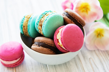 Colorful macaroons and tulips