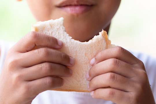 Closeup A Child eating bread