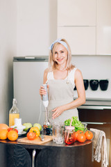 Young woman cooking in the kitchen