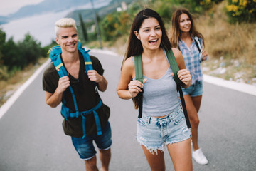 Group of happy friend traveler walking and having fun. Travel lifestyle and seasonal vacation concept