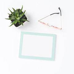 Photo frame, sunglasses and succulent. Fashion background