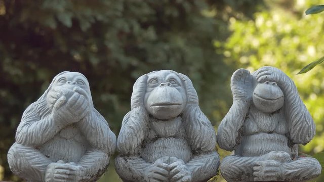Statues of three wise monkeys.