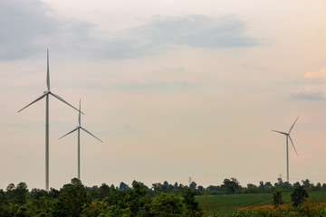 Wind turbine farm power generator in beautiful nature landscape for production of renewable green...