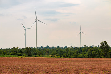 Wind turbine farm power generator in beautiful nature landscape for production of renewable green...