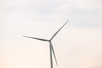 Wind turbine farm power generator in beautiful nature landscape for production of renewable green...