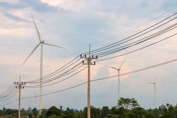 Obraz premium Wind turbine farm power generator in beautiful nature landscape for production of renewable green energy is friendly industry to environment.