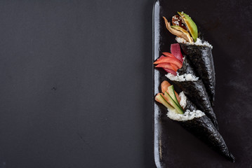 Sushi temaki with avocado on black © rostyslav84