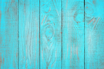 Fototapeta na wymiar Old weathered wooden plank painted in turquoise blue color. Vintage beach wood background.