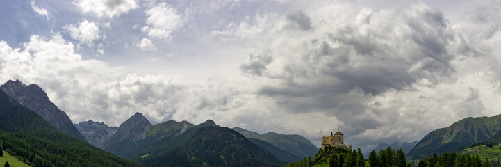 Fototapeta na wymiar Panorama Landscape of the Lower Engadine Valley in the Swiss Alps with Tarasp Castle