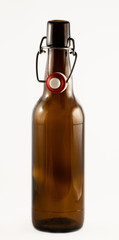 Brown bottle of beer isolated on white background.