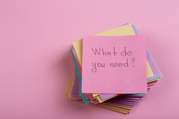 Help and advice concept - sticky note with text What do you need