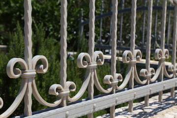 Metal fence. Metal curly fence in the park
