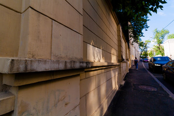 landscape old city cement wall and pavement with walking people