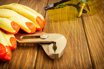 Hand tool on dark wooden background with advertising space.