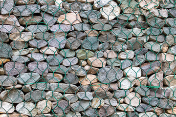 Stones in a metal grid as a background