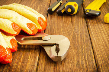 Hand tool on dark wooden background with advertising space.