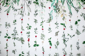 Flowers composition. Garland made of various colorful flowers and branches on white background.
