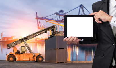 Foreman or working man hold tablet control loading Containers box