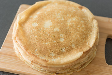 Traditional russian pancakes. Thin homemade pancakes with crispy crust. Maslenitsa holiday.