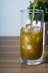 filling an empty ice cold glass with sugar cane