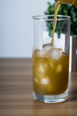 filling an empty ice cold glass with sugar cane