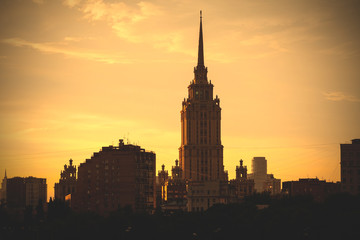 Fototapeta na wymiar sunset cityscape with tower in Moscow, Russia