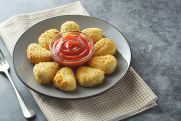 Chicken nuggets with ketchup. Fast food.