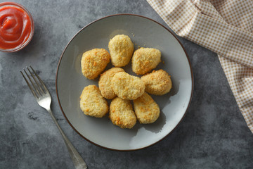 Chicken nuggets with ketchup. Fast food.