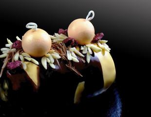 Christmas Buche Noel cake with orange mousse and fancy decorations