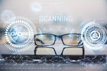 Data tech hologram with glasses on the table background. Concept of technology. Double exposure.
