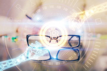 Cryptocurrency hologram over woman's hands writing background. Concept of blockchain. Multi exposure