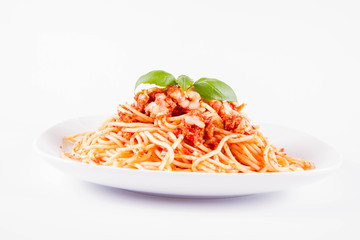 Spaghetti bolognese with melted parmesan cheese decorated with basil on a white background	