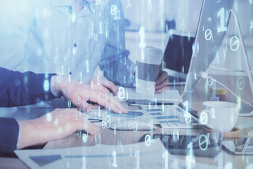 Double exposure of technology hologram with man working on computer background. Concept of big data.