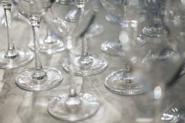 Empty wine glasses closeup. In a row, focus on foreground