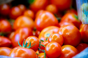 Tomatoes at the market display stall