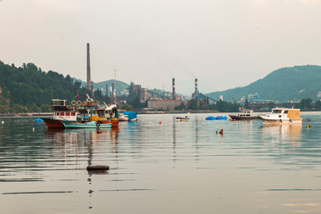 Zonguldak eregli district, fishing boats and erdemir iron and steel factory behind June 24,2019, Eregli, Zonguldak, Turkey