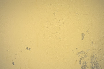 Texture of wet, peeling plaster on the wall
