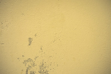 Texture of wet, peeling plaster on the wall