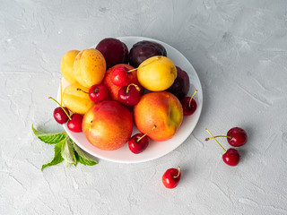 Beautiful ripe fruit on a white plate.