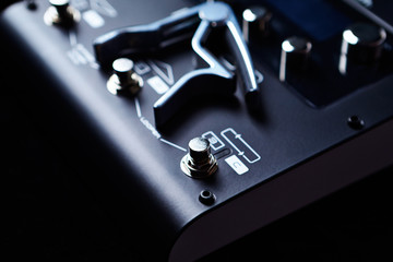 Multieffects Processor for Electric Guitar on black background. 