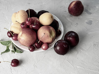 Beautiful ripe fruit on a white plate.