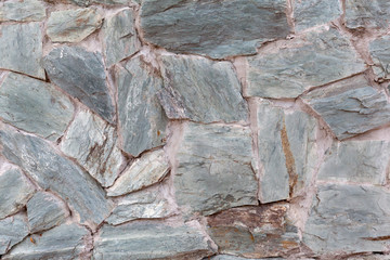 Part of the stone wall in daylight