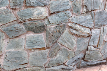 Part of the stone wall in daylight