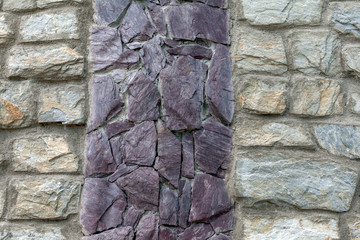 Part of the stone wall in daylight