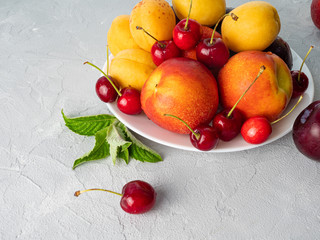 Beautiful ripe fruit on a white plate.