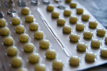 small yellow pills tablets blaster