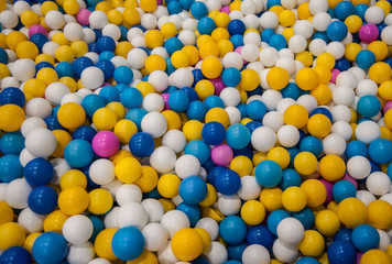 multicolored bright balls swimming pool