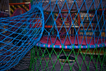 multicolored macro thread webs on a playground
