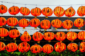 Red paper lanterns of the festival about Chinese people hanging on the rails wall