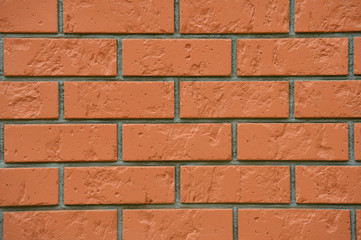 Texture of a bright, red, new brick wall